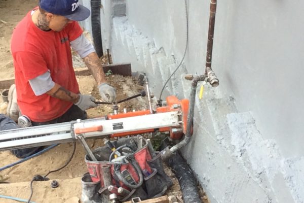 installing drain pipe 4 © amronconstruction.com